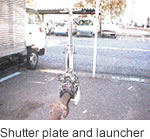 Shutter plate and launcher