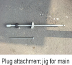 Plug attachment jig for main